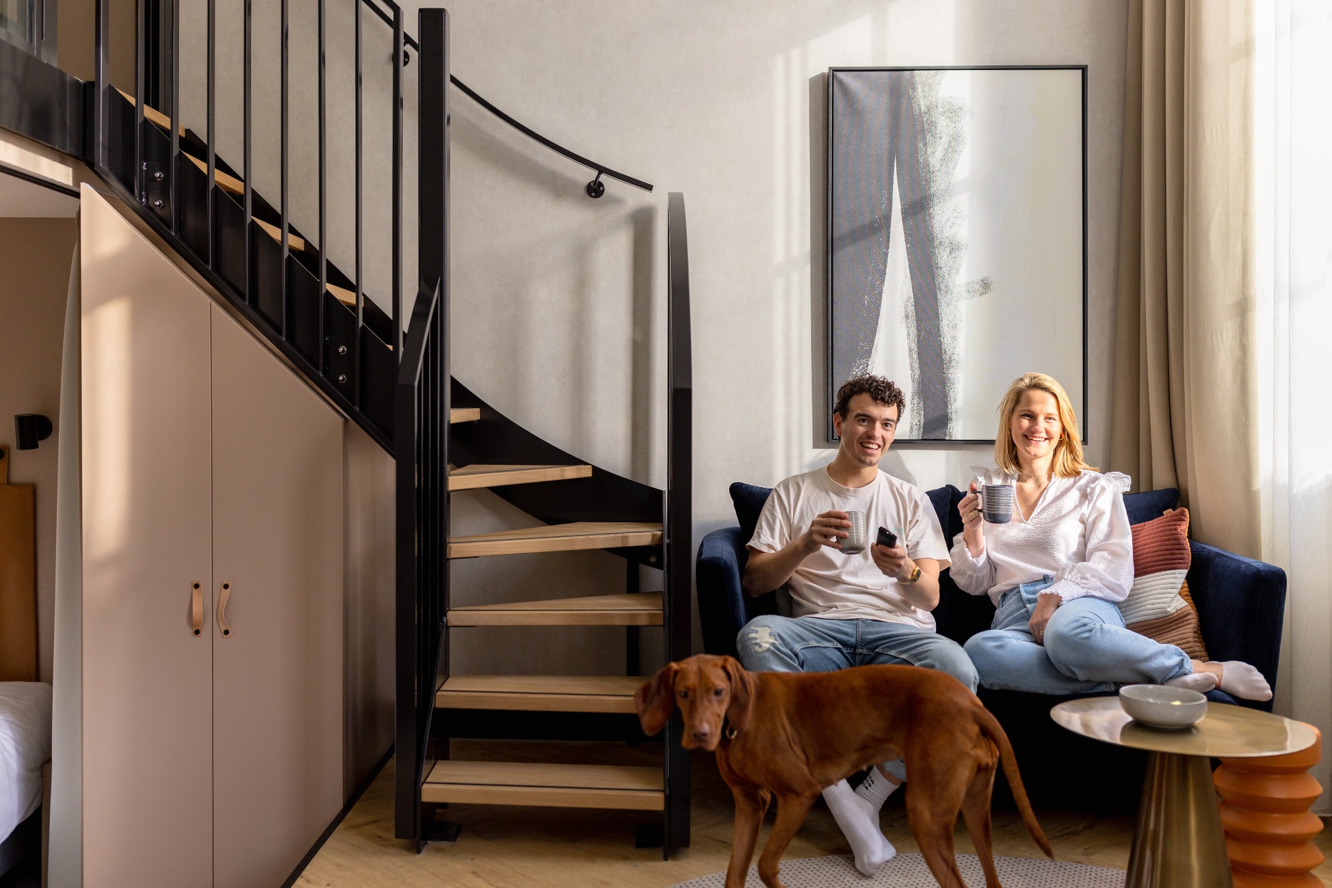 Couple with their dog in the apartment