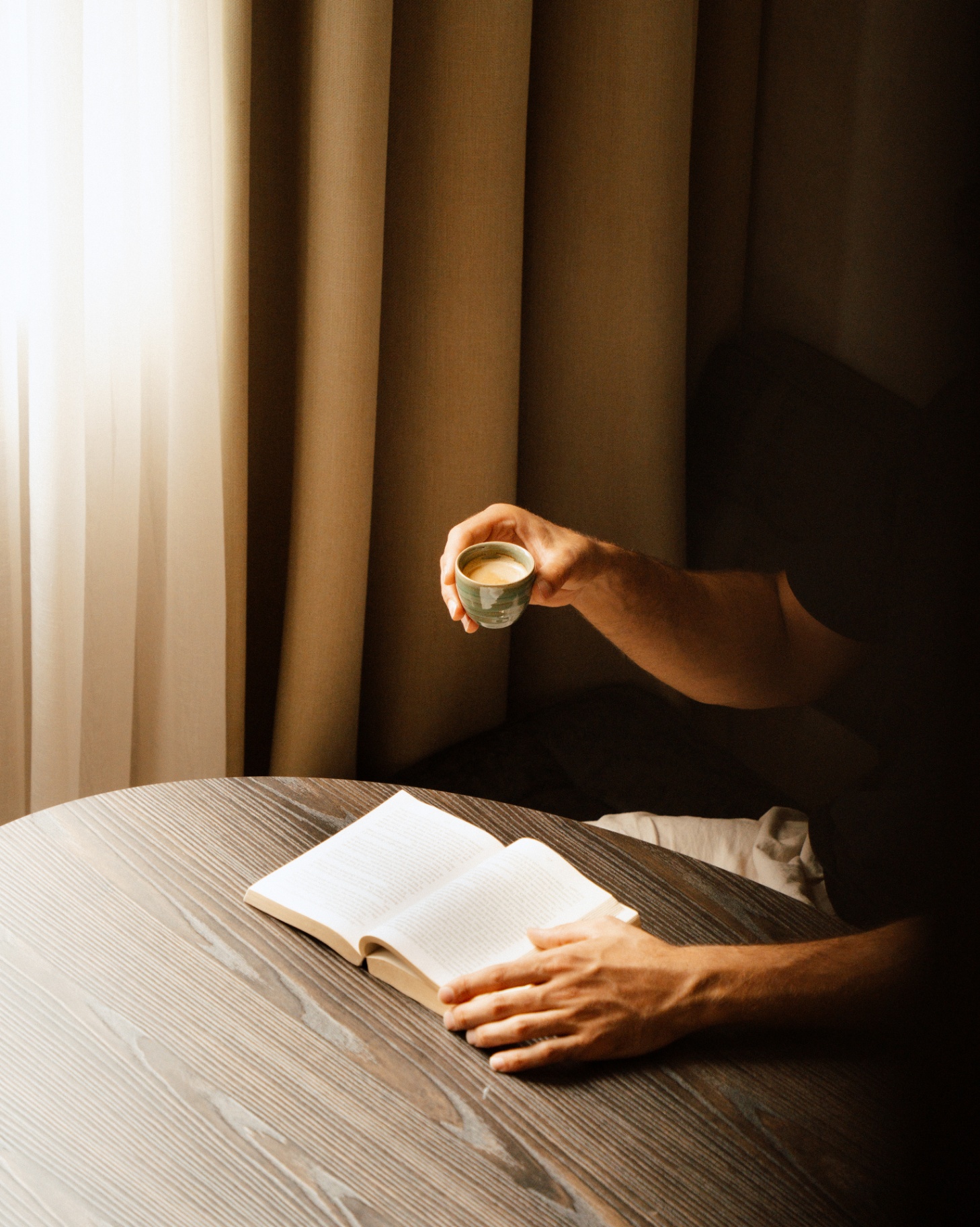 Morning coffee with a book by the window